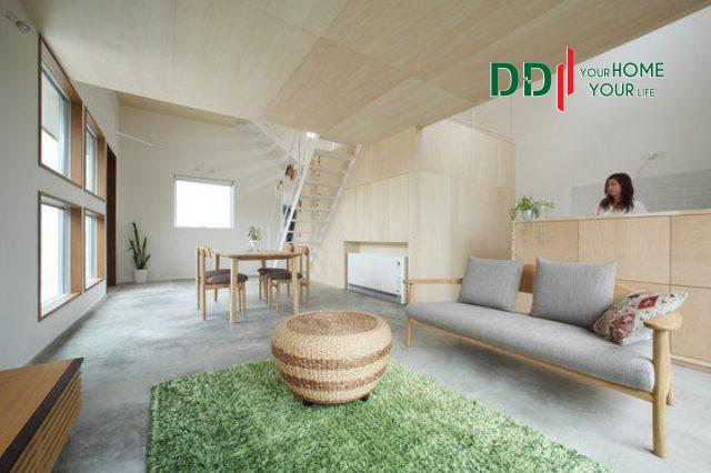 Tấm thảm nơi phòng khách như một điểm nhấn mang không gian xanh mát vào nhà.